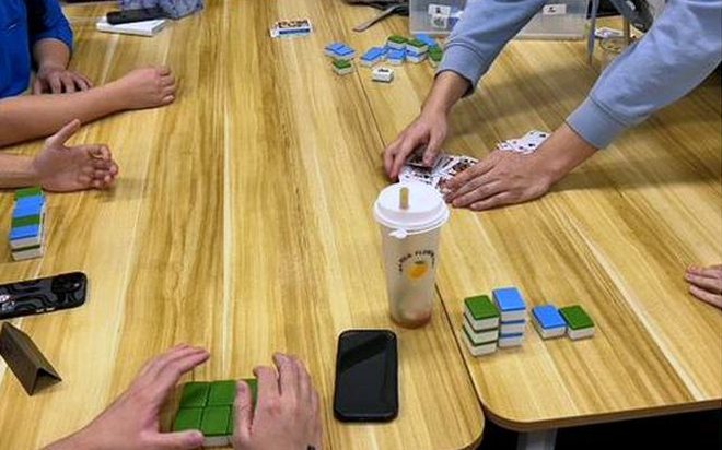 Members playing a table game together during an AWS UNSW mentoring session